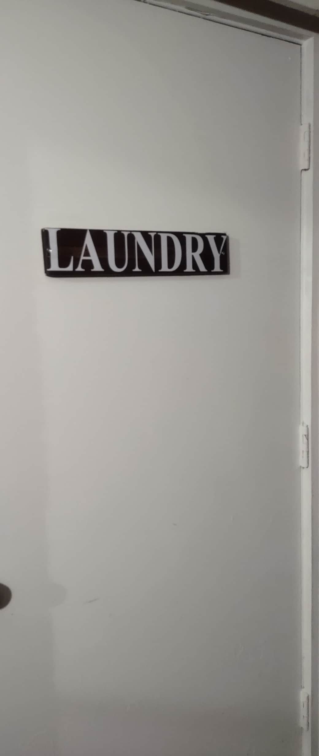 The laundry room on off of the back porch houses the dryer