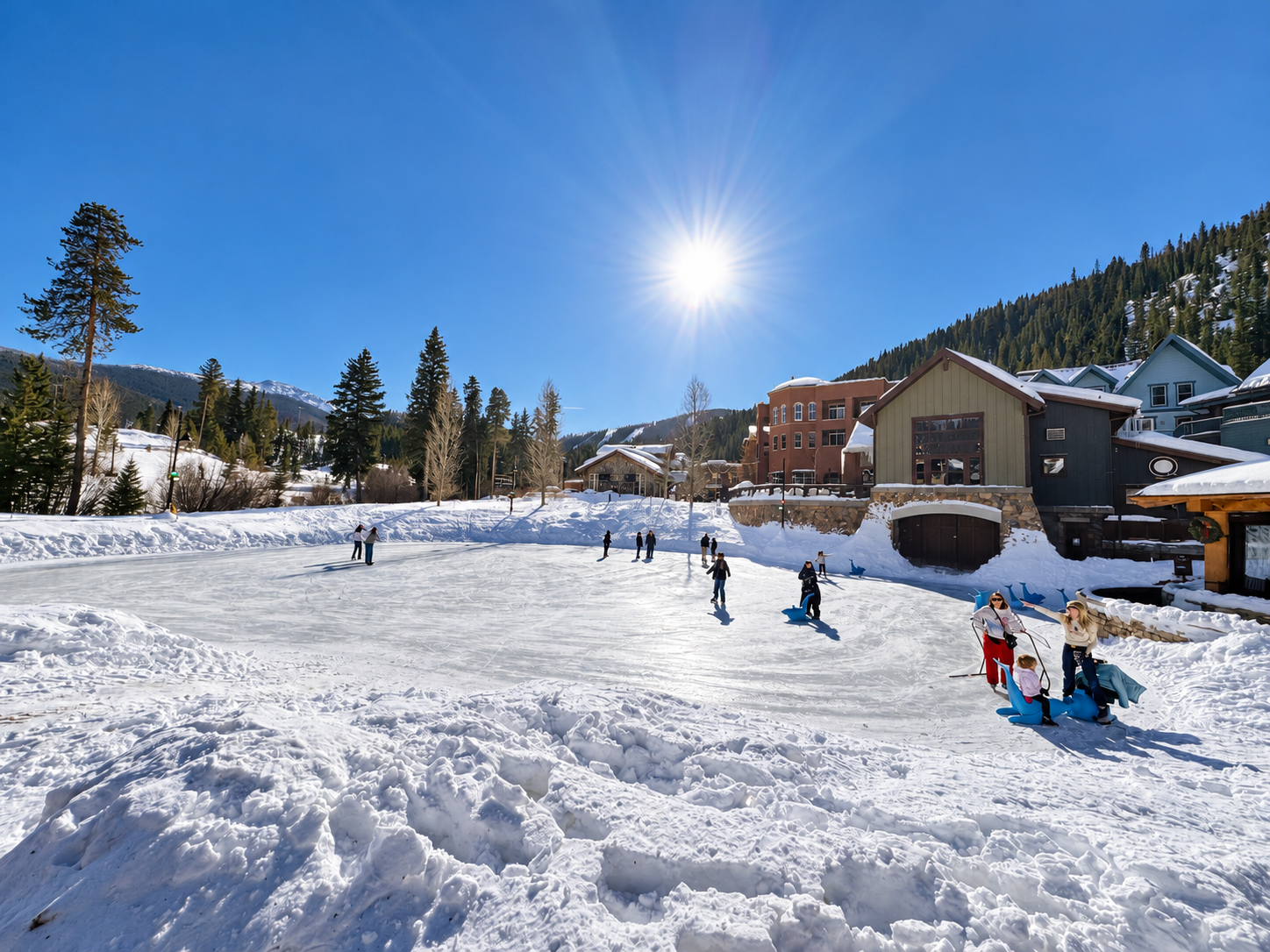 Ice skaters on the outdoor rink in the Winter Park Resort village