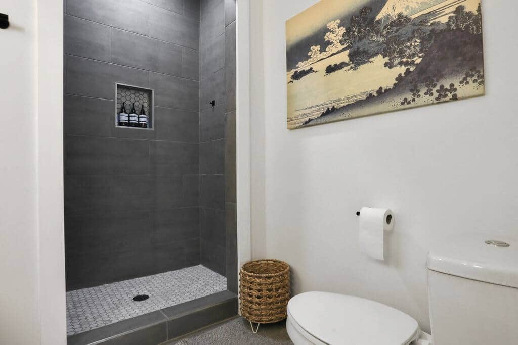 Luxurious walk-in shower - provided with shampoo, conditioner, and body wash