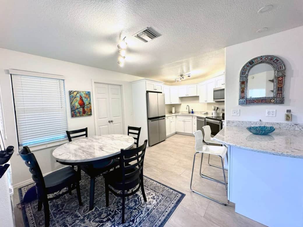 Enjoy your cozy table overlooking the patio. More seating is available at the bar. Enjoy your cozy table overlooking the patio. More seating is available at the bar.