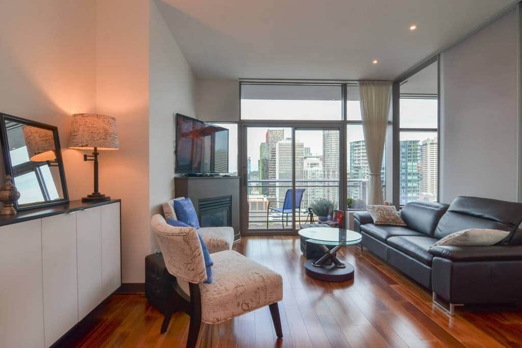 Spacious living room with flatscreen TV and beautiful city views