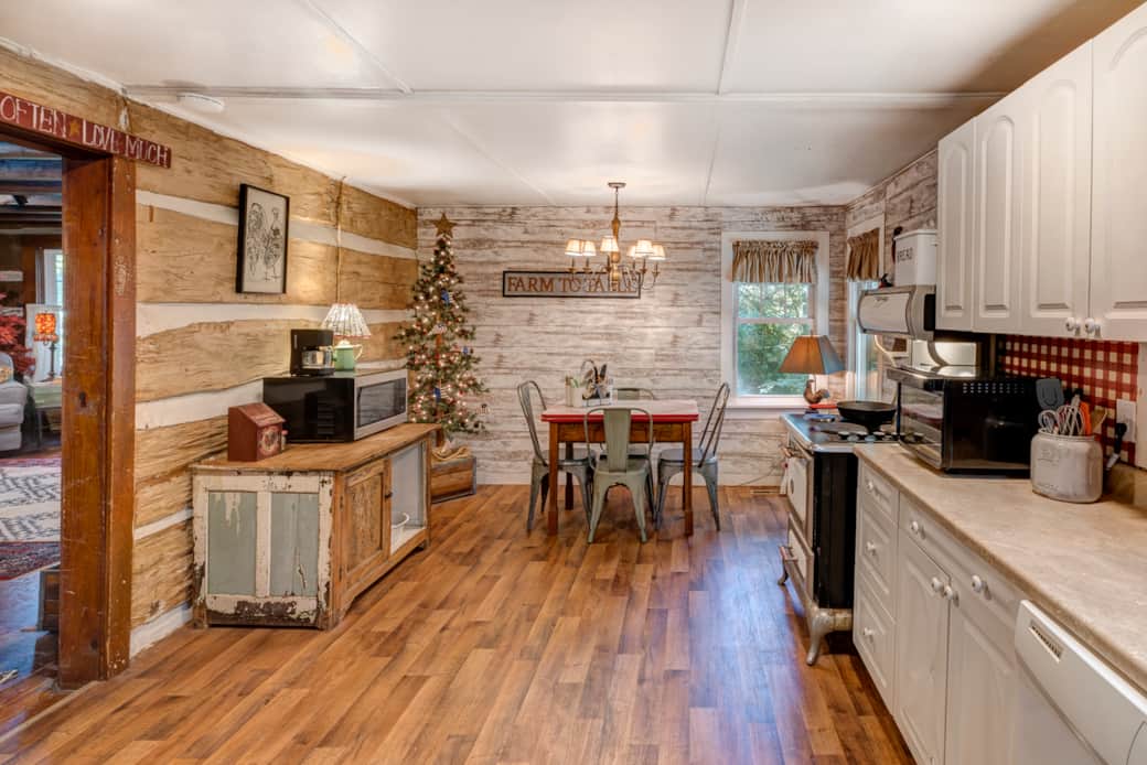 Nicely equipped kitchen combines modern convenience with authentic cabin character