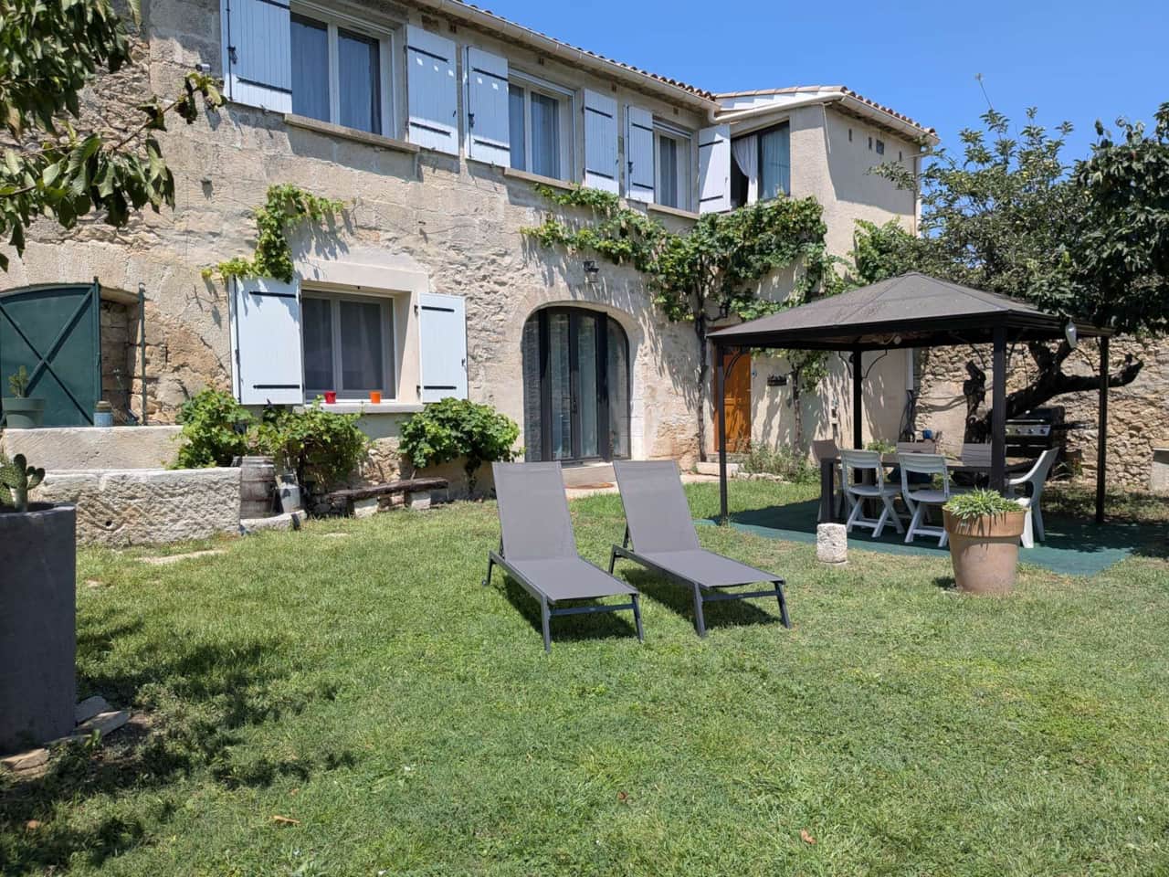 Stone villa with a garden and a gazebo