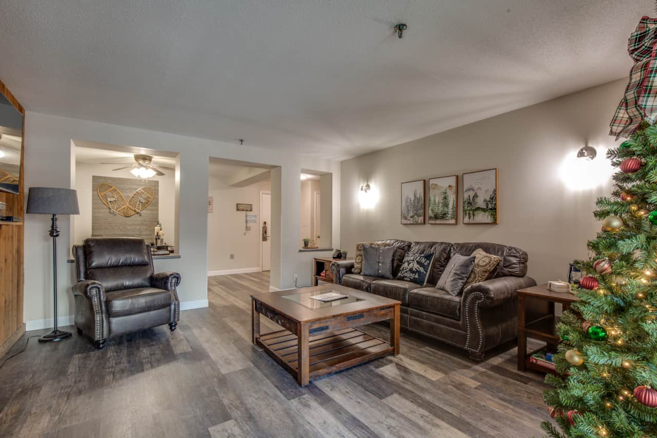 Plush sofa and recliner to relax in front of the electric fireplace