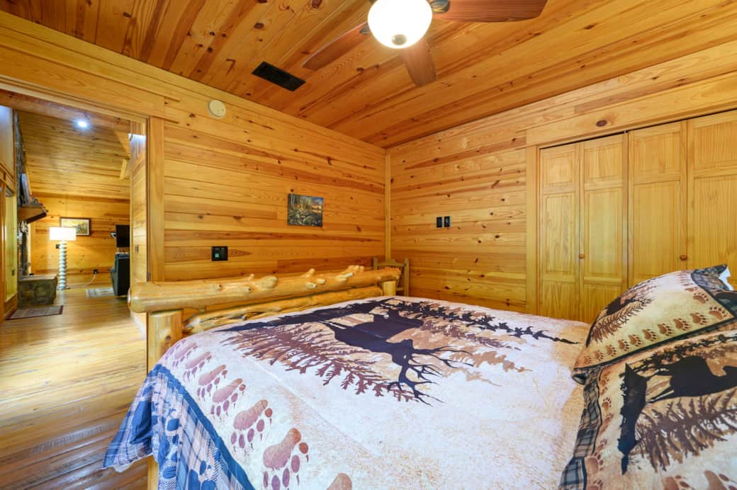 View of queen bed showing hallway