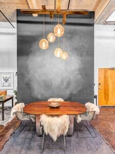 Dining area with custom made table and custom made chandelier