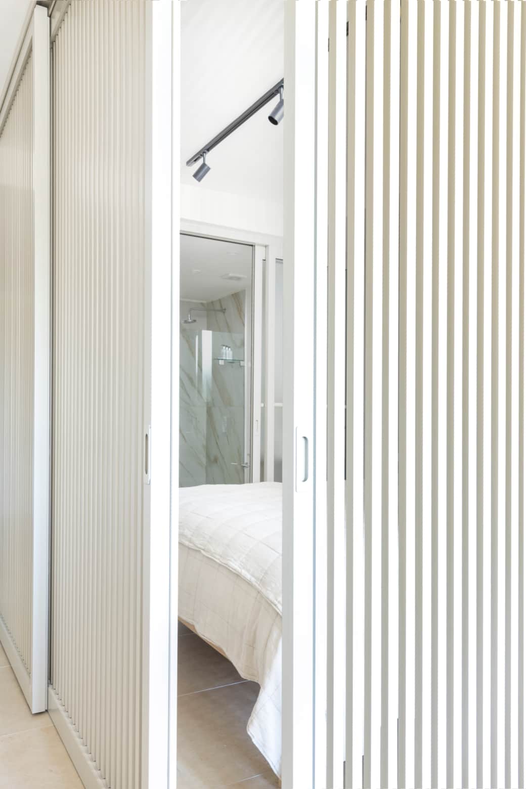 The studio bed is thoughtfully screened for a restful night’s sleep