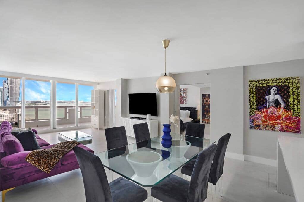 Dining area, living room, balcony access, Roku streaming Tv