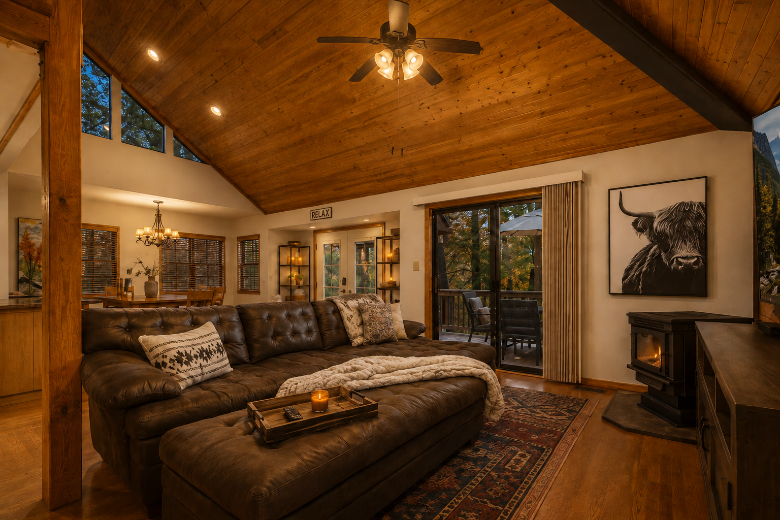 Living room with sofa and deck access in Munds Park cabin