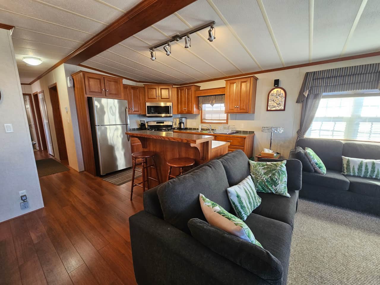 Living area and kitchen with breakfast bar 