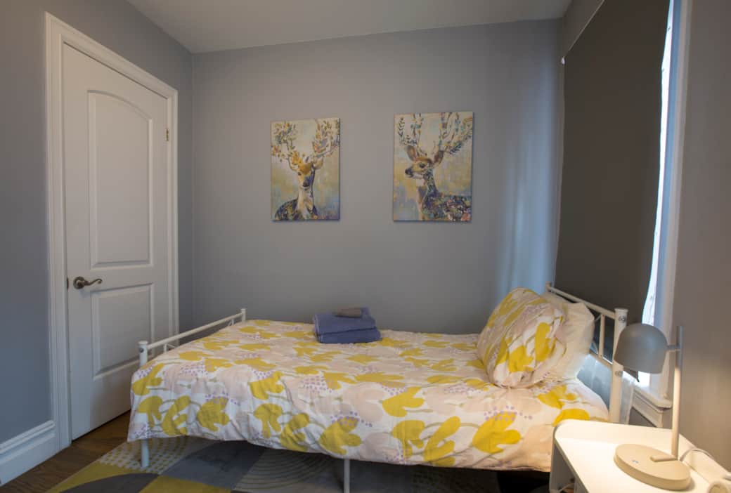 The front bedroom has a dresser and full closet