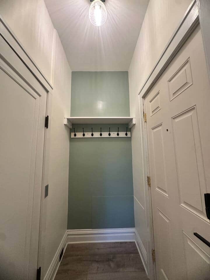 Home entrance. Steps to the basement and access to the kitchen are located here.