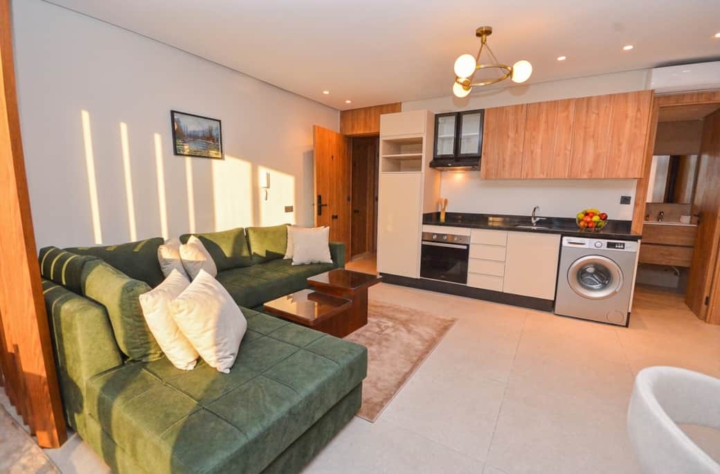 Modern Studio with Green Sofa Modern Studio with Green Sofa