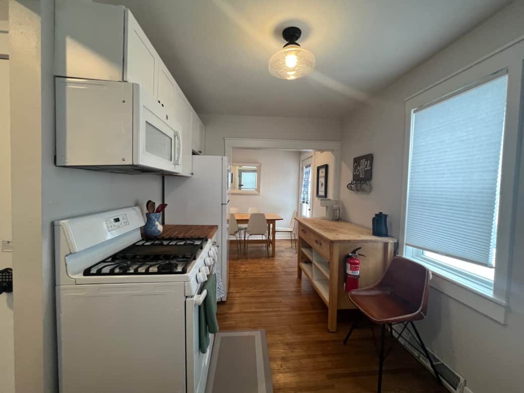 Farmhouse kitchen stocked for real cooking — pots, pans, baking sheets & all essentials