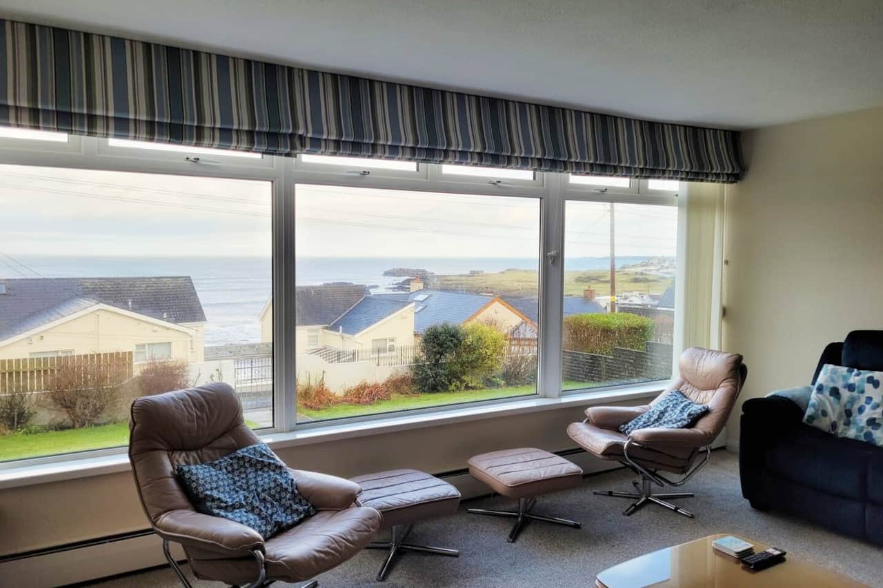 The view from the sitting room is fabulous. On a really good day you can see Islay in Scotland but watch the golfers on The "Old Course" Portstewart and hear the waves crashing on the rocks just 150 metres from the house.