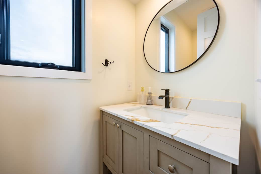Bathroom near the kitchen at Driftwood Carolina Carolina Beach rental