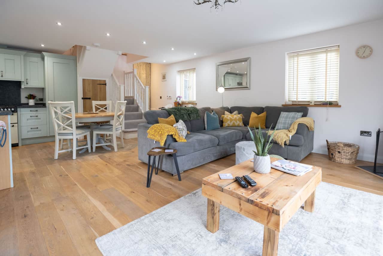 Spacious lounge with plush seating and scenic outdoor views.