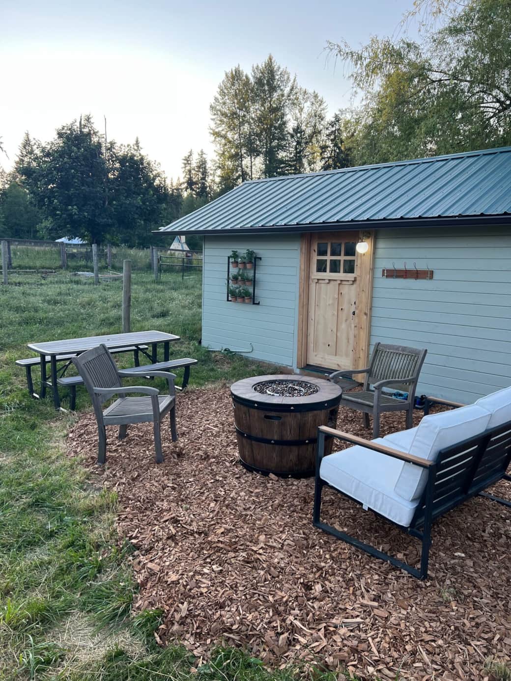 Outside of the Sun Cabin with a private gas fire pit and picnic table Outside of the Sun Cabin with a private gas fire pit and picnic table