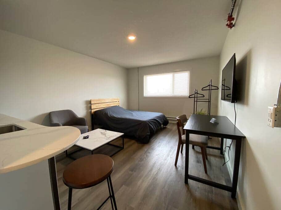 bedroom with workspace and kitchenette bedroom with workspace and kitchenette