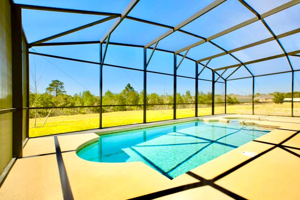 A beautiful private pool and spa with views over the conservation area