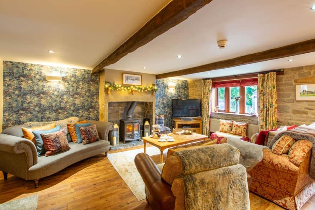 The main Lounge is spacious with plenty of comfortable seating, a feature multi-fuel stove fireplace & a large TV with sound bar.