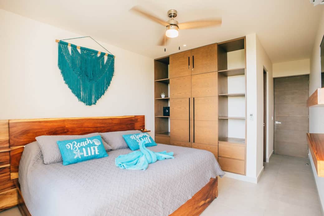 The main bedroom features a comfortable king-size bed, a smart TV, a full wardrobe for storing your clothes, a secure in-room safe, and a private en-suite bathroom for added comfort and convenience during your stay.