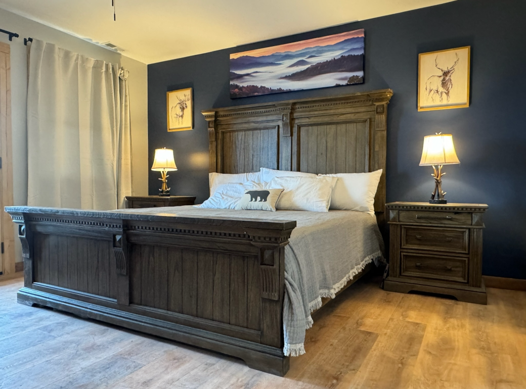 King Master Suite with built-in charging stations in each nightstand and spacious dresser