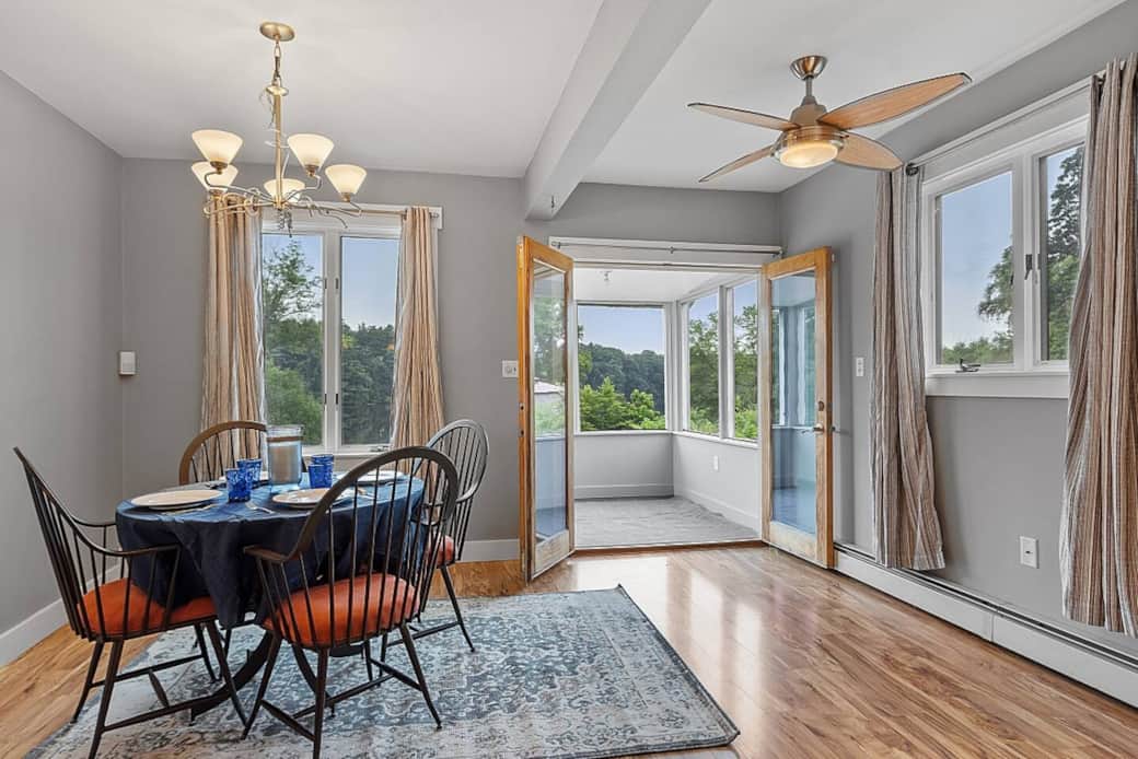 Dining room opens to screen porch overlooking the river. Dining room opens to screen porch overlooking the river.