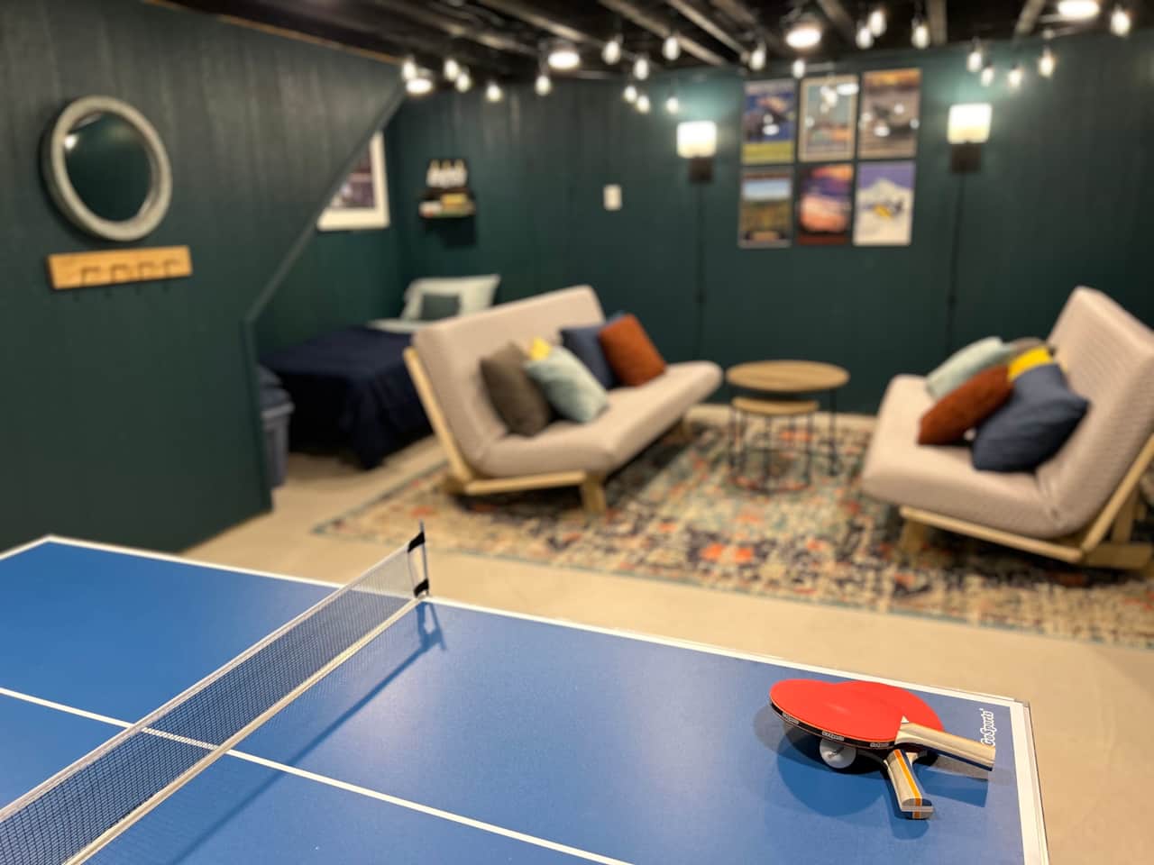 A mid-sized ping-pong table is in the basement for a little competitive fun.