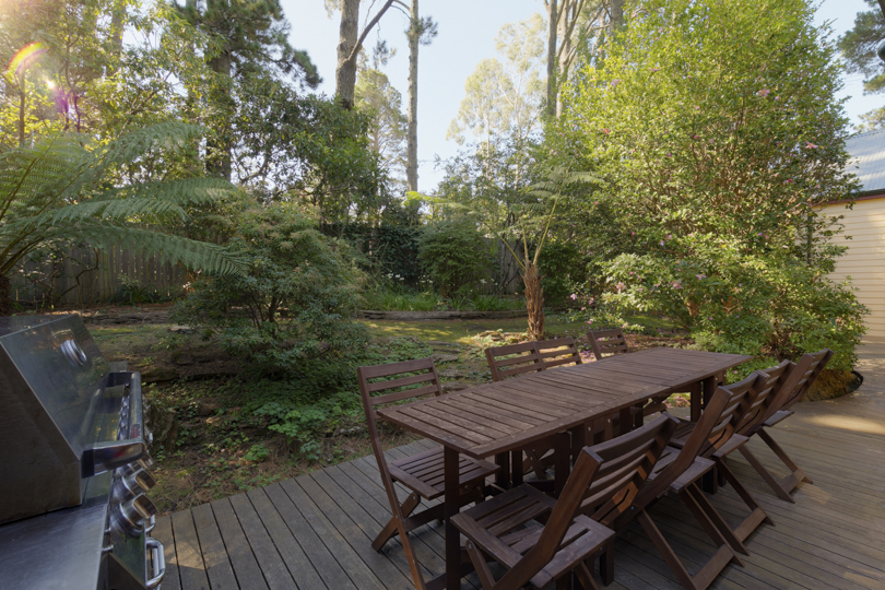 Outdoor area with large BBQ and outdoor setting