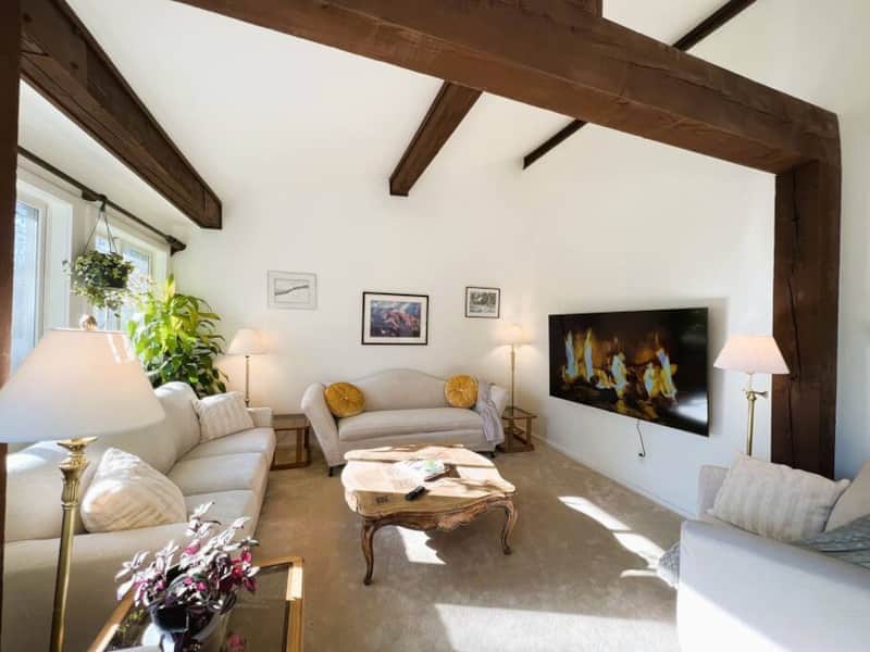 Comfortable Living room with 75” TV and sound system
