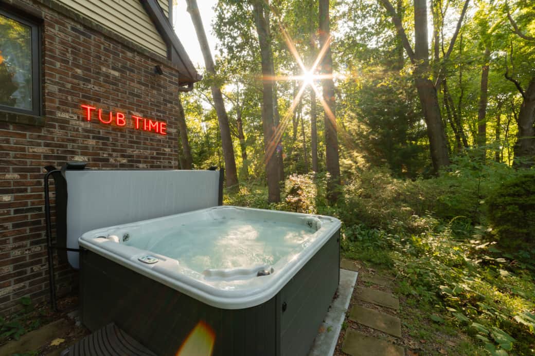 Secluded outdoor hot tub surrounded by trees near Lake Michigan