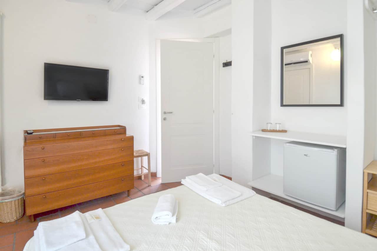 Adriana - bedroom - dresser - tv - refrigerator
