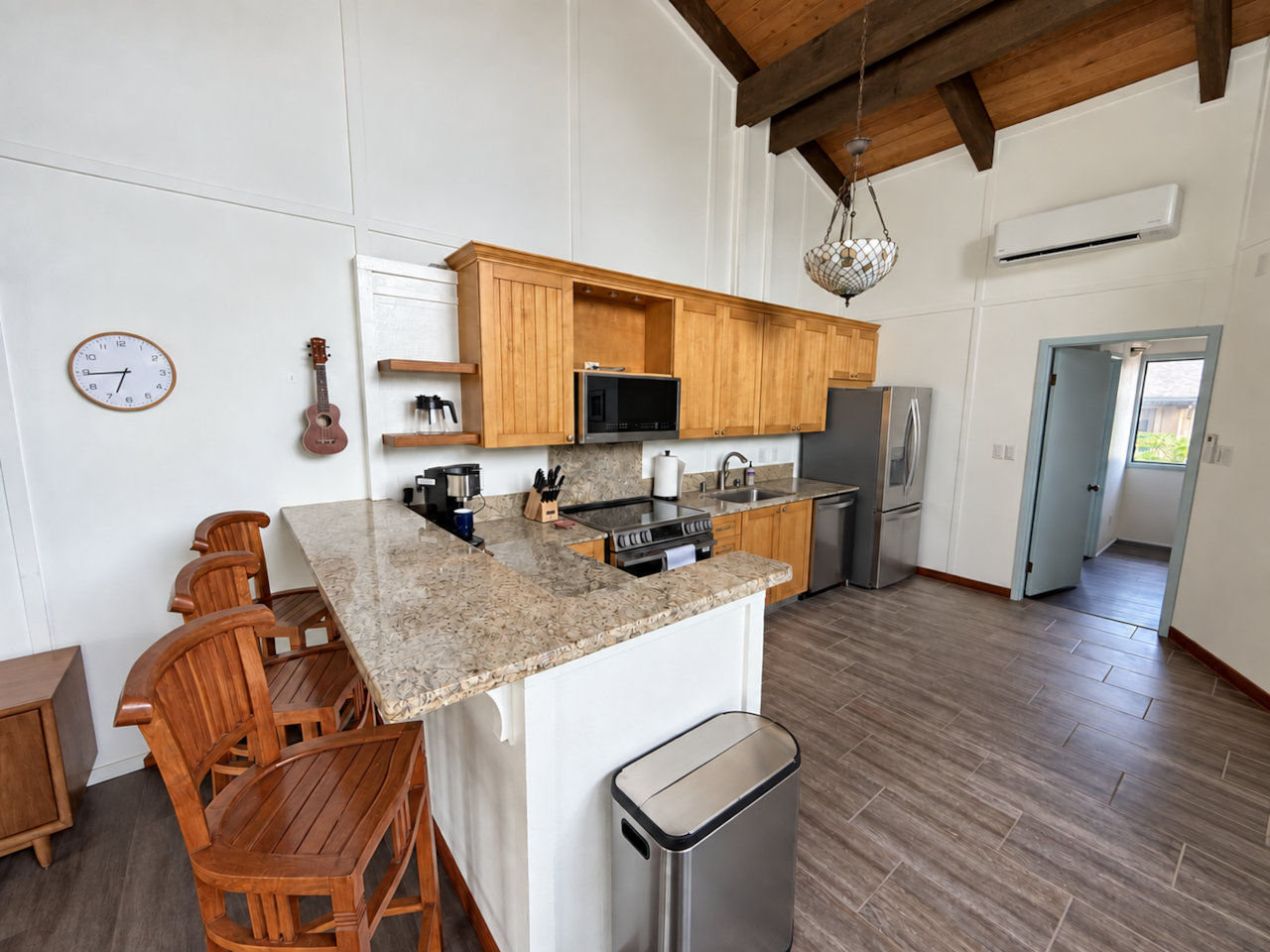 Breakfast bar with seating beside the kitchen