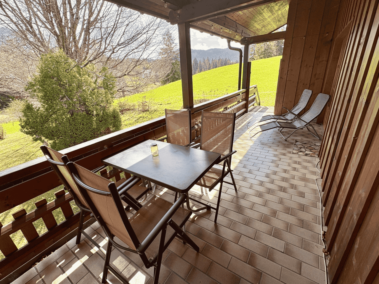 Large south-facing balcony with garden access