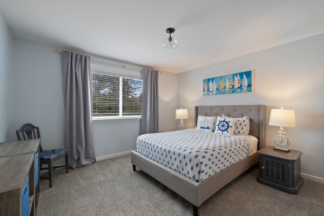 Comfortable queen bedroom with plenty of space, ideal for multi-family or multi-generational stays.