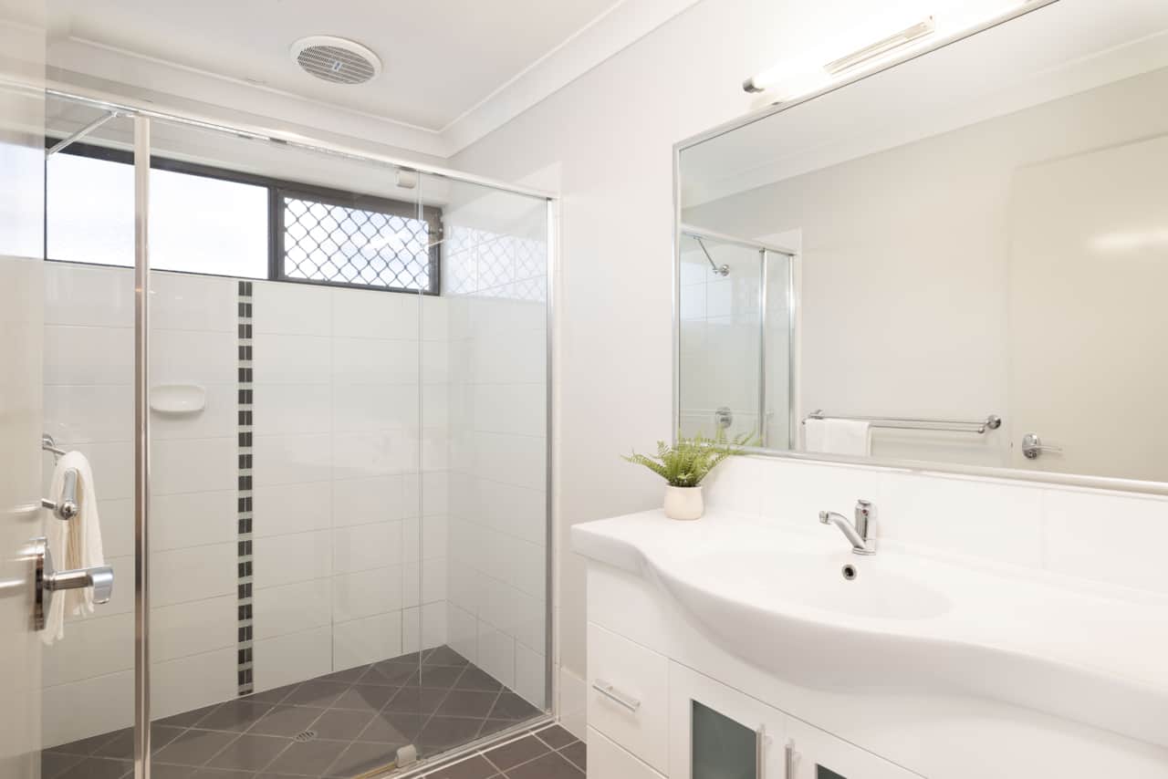Bathroom: Stylish bathroom with walk-in shower, vanity, and clean finishes 
