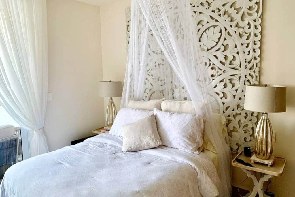 Unwind in ultimate comfort and luxury with a plush bed and pillows.