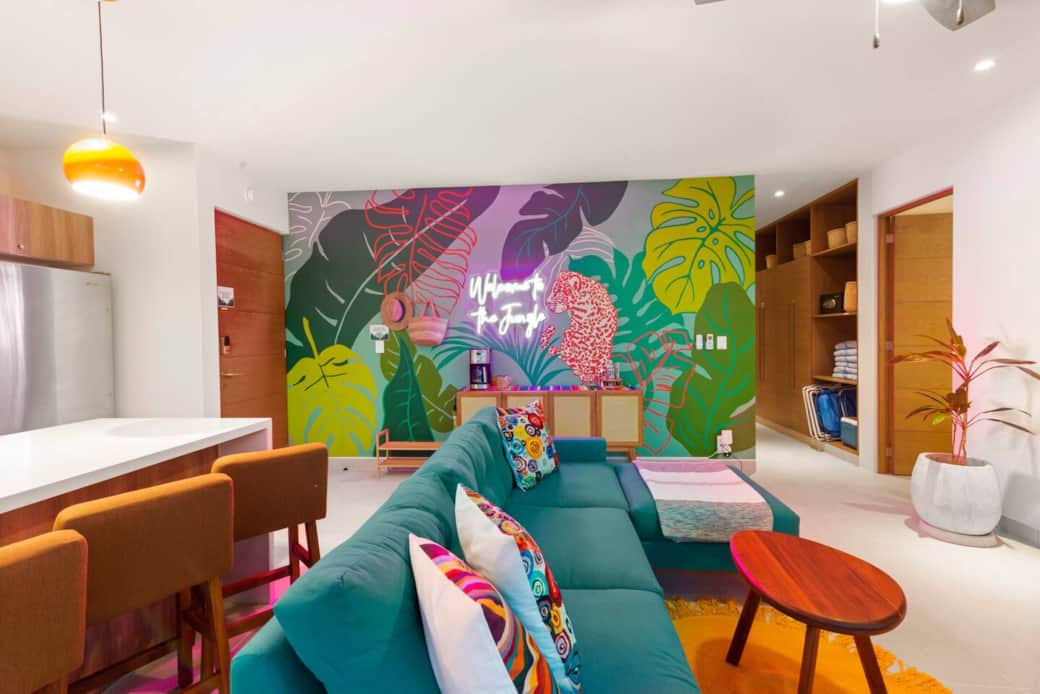 Not only does the living room feature a comfy couch, smart TV, and direct access to your private balcony, it also includes A/C and a ceiling fan. In the hallway, you’ll find beach chairs, a cooler, a safe, and beach towels.