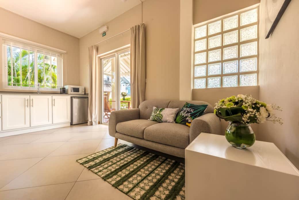 Small living area with Kitchen overlooking the terrace and garden with shared pool Small living area with Kitchen overlooking the terrace and garden with shared pool