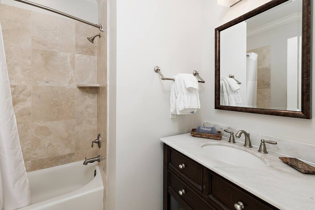 Ensuite attached to third floor bedroom #2 with bathtub and shower.