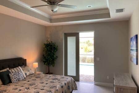 Master bedroom, king bed with patio doors to pool. Master bathroom private entrance.