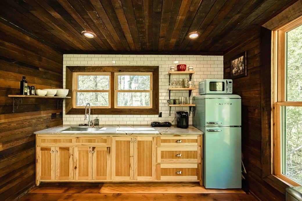 Our kitchenette has a hot plate with two burners, a fridge, microwave oven, and tons of pans, pots, stemware, glasses, etc.  You can also cook in our wood fired pizza oven, air fryer, or on the Blackstone style griddle/grill.  