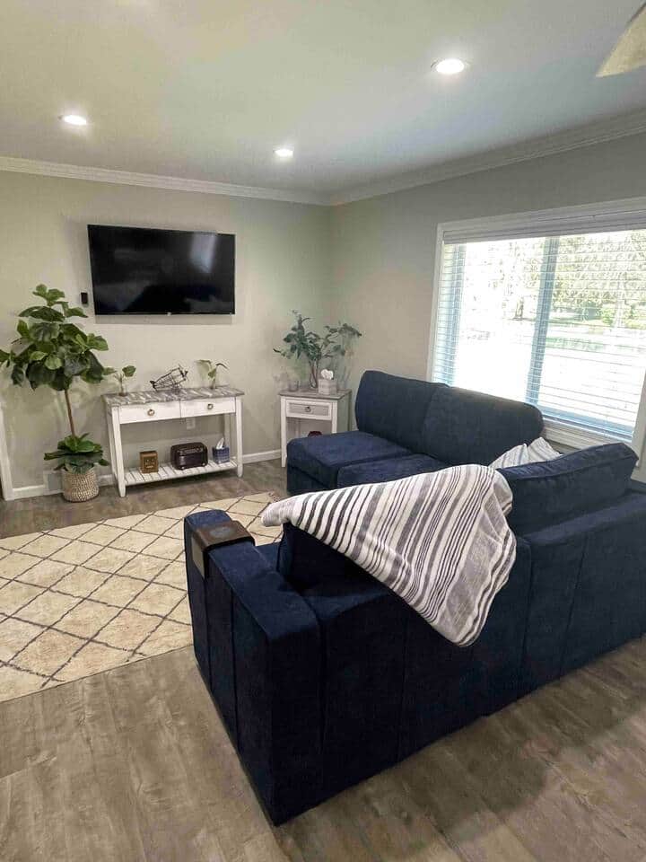 Modern living room with smart TV and natural light