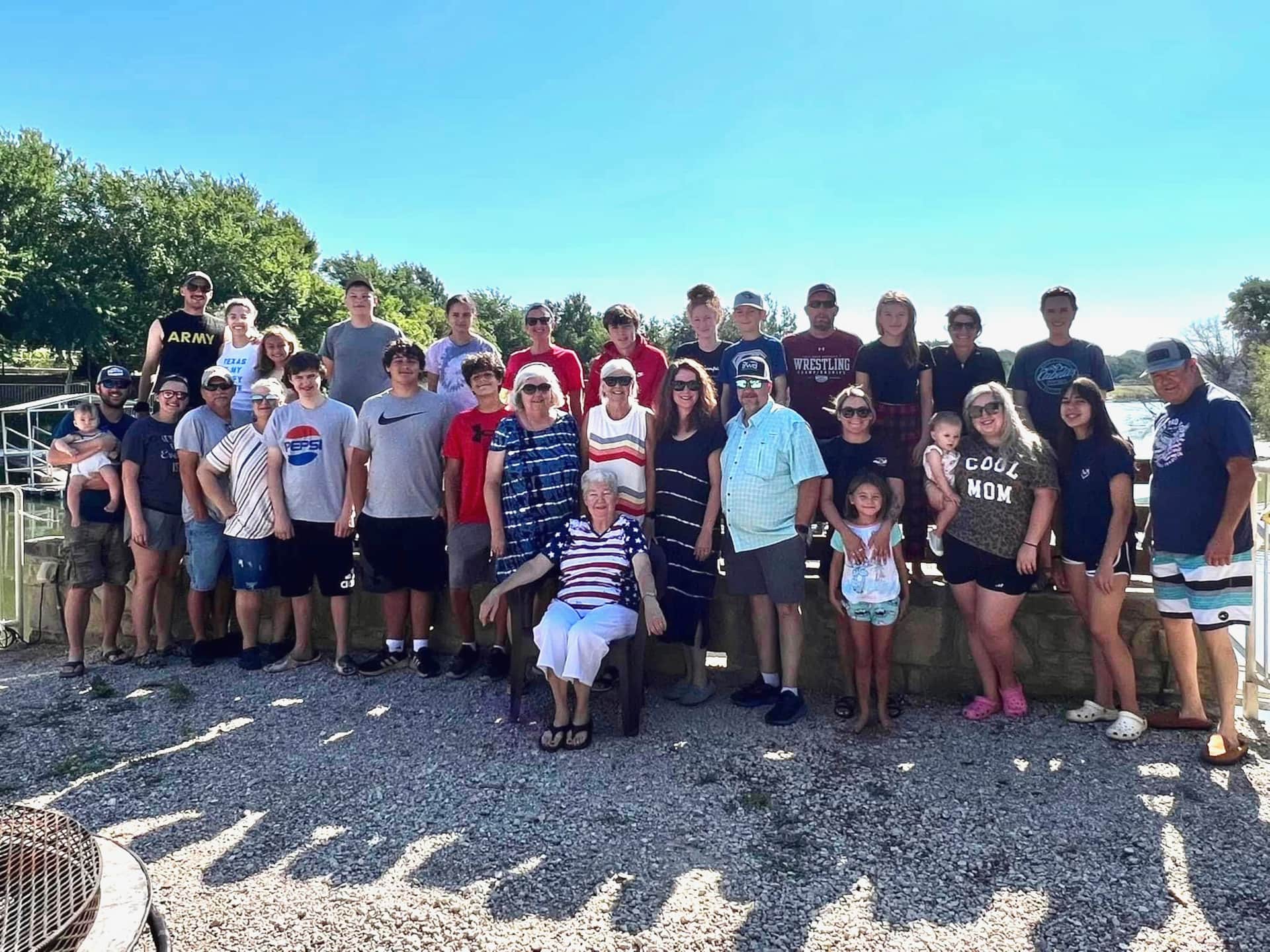 Family Reunion Group Photo Lodge Firepit overlooking Lake Godstone in Graford, Texas