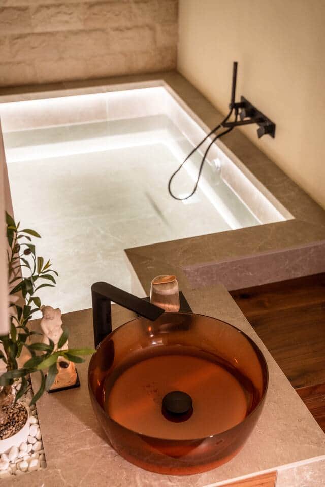 Your private bath ritual begins with aromatic salts in the handcrafted cave tub.