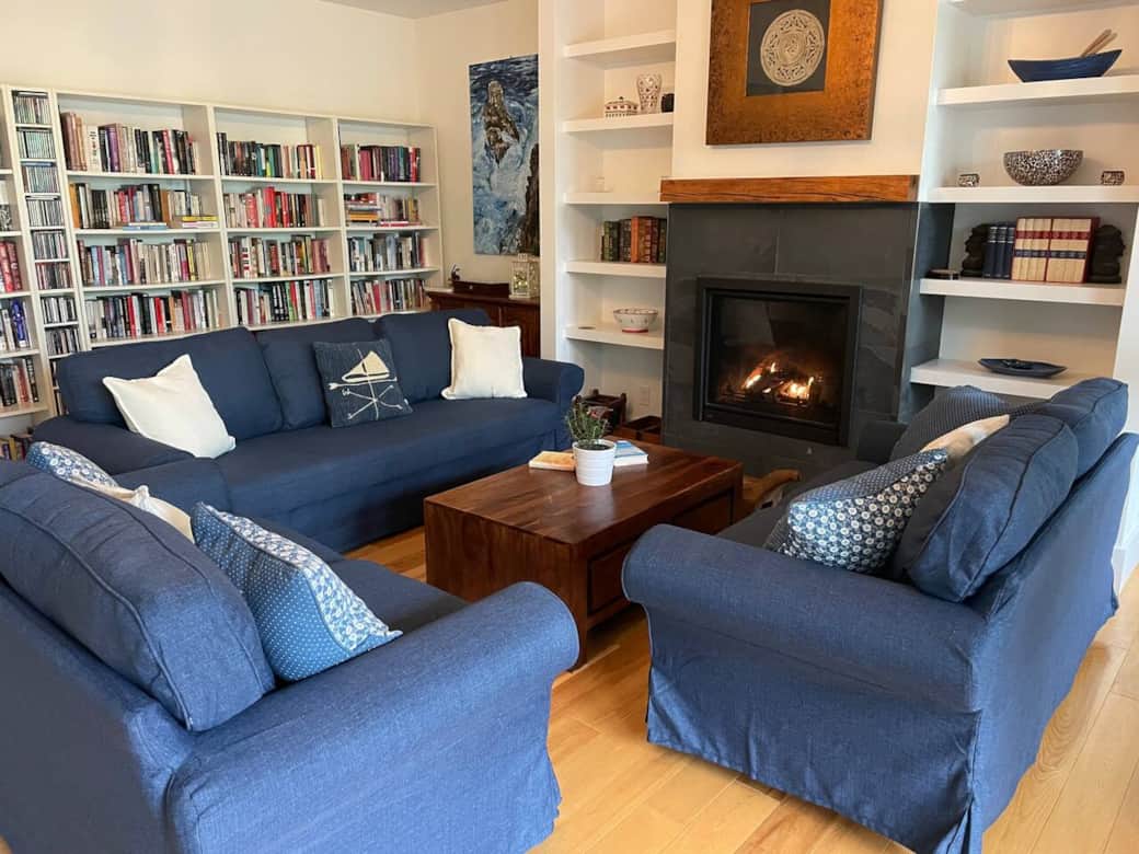 Living room with gas fireplace and full library full of novels and CDs.  Has a sofa bed too.