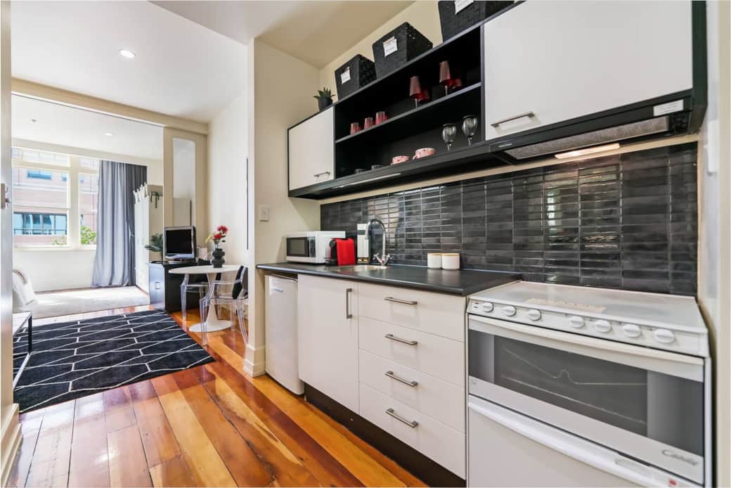 Kitchen with microwave, stove, dishwasher, fridge, Nespresso bar