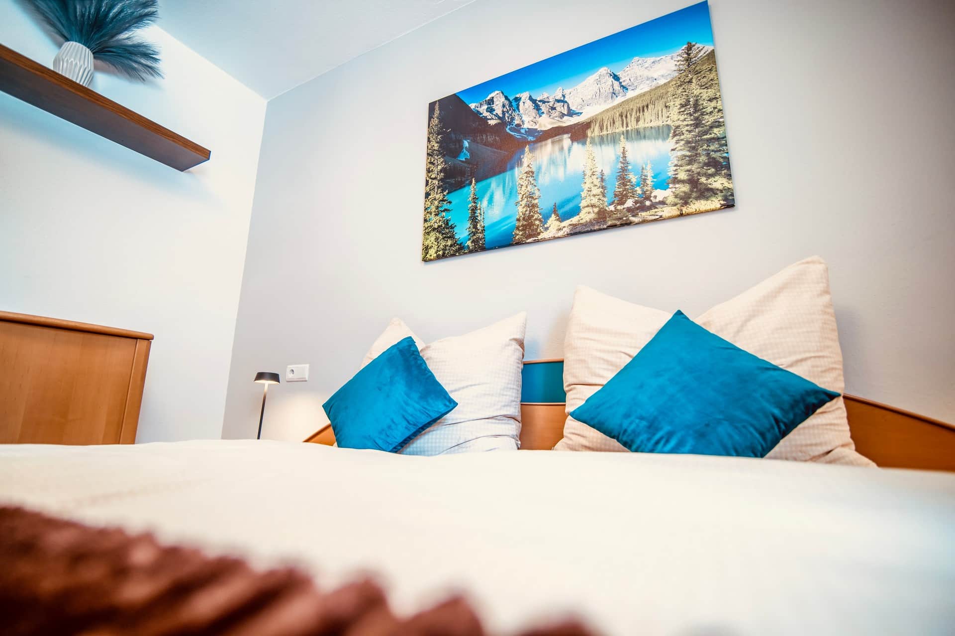 Cozy double bedroom with double bed in the Stadtnestl apartment in Sterzing