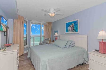 Master bedroom with king-size bed includes ocean views, direct balcony access and adjacent bathroom!